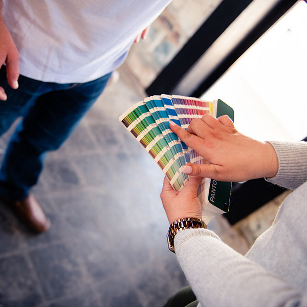 woman pointing at color samples