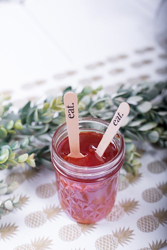 jar of jam with spoons that say eat
