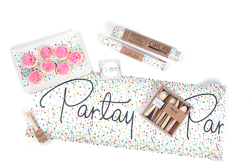 confetti paper laid out that says Partay
