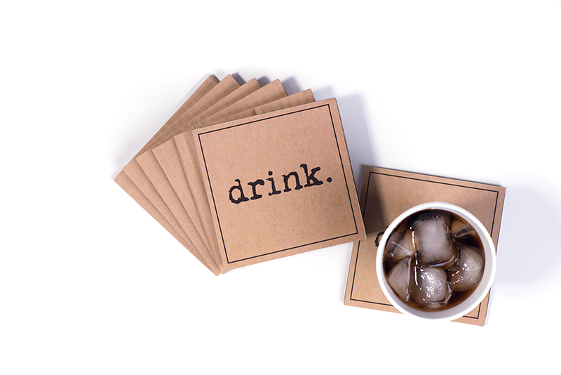 tan colored square coasters that say Drink