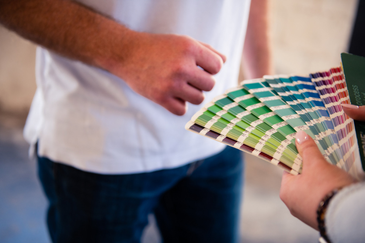 business owner and designer reviewing color samples