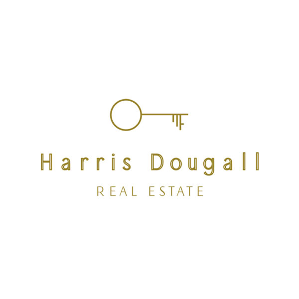 Elegant gold key real estate logo for a real estate brand, with stylish lettering suitable for upscale property businesses.