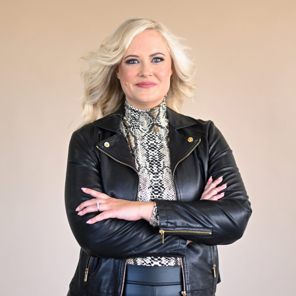 A blonde woman in a leather jacket and skirt exemplifies business marketing done right.