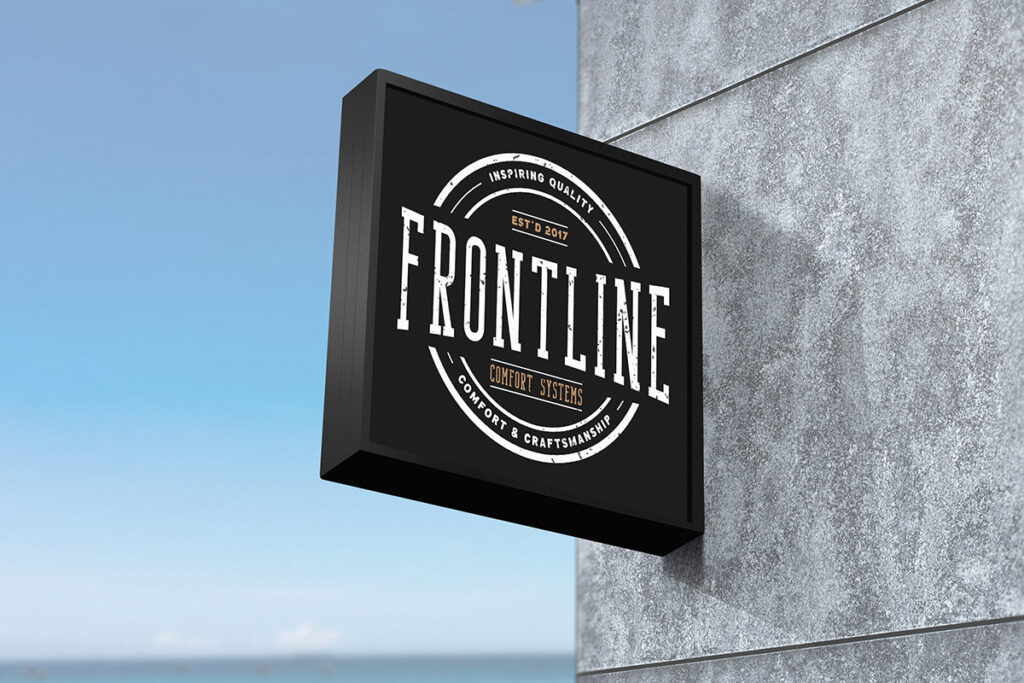 A black sign that says "frontline" on the side of a building, showcasing the creative prowess of a graphic design portfolio.