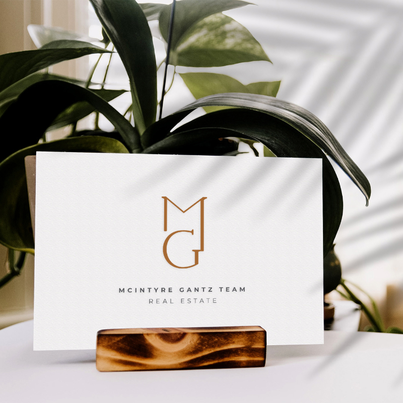 A marketing business card featuring a plant on top, perfect for showcasing your brand in a modern lounge setting.