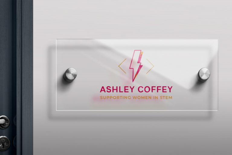Office door sign showcasing "Ashley Coffey - supporting women in STEM" with a lightning bolt symbol, reflecting our corporate branding.