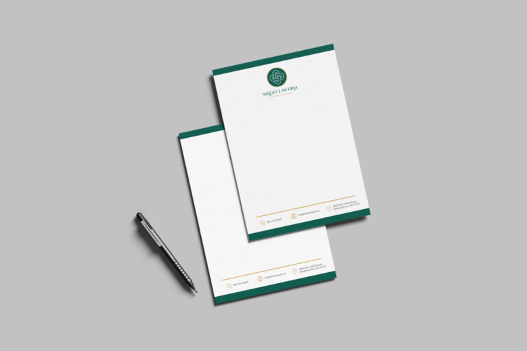 Two branded notepads with a pen, featuring a green logo at the top, placed on a gray background.