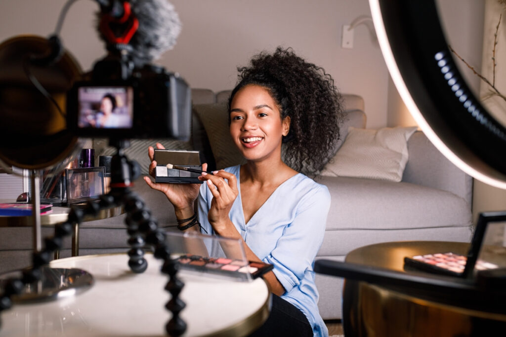 A woman recording a video tutorial, representing on-camera engagement as a key brand trends for 2025.