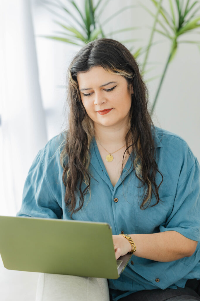 Small business owner working on website conversion strategy to improve website conversion through small business website optimization and a marketing roadmap.