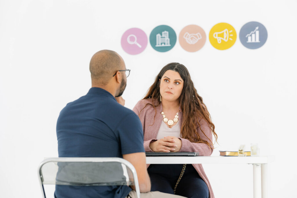 Oakes Creative House team member meeting with a client during a marketing roadmap strategy session focused on small business growth, brand foundations, and long-term marketing planning.