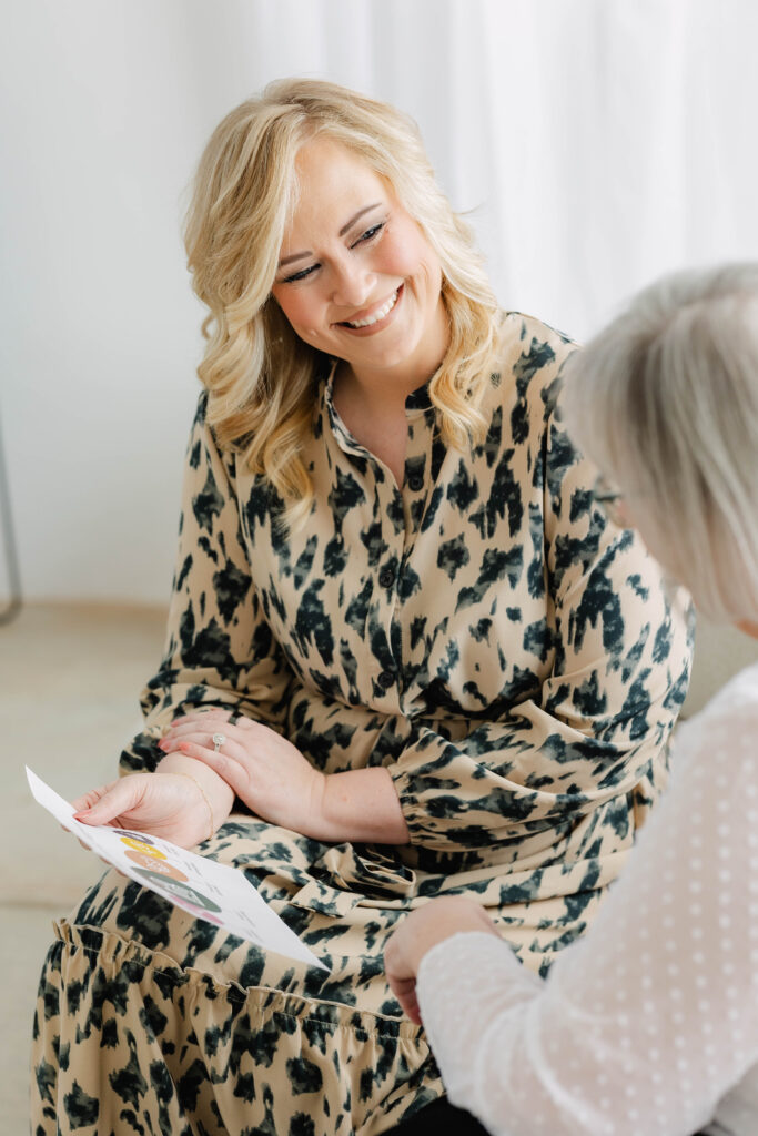Business owner reviewing a marketing roadmap during a strategy session to create a sustainable business growth plan without burnout.